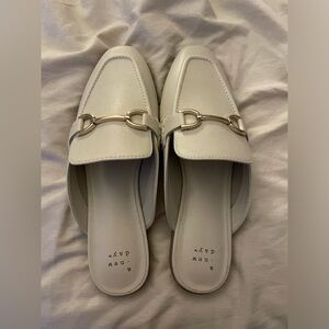 White flats with gold hardware